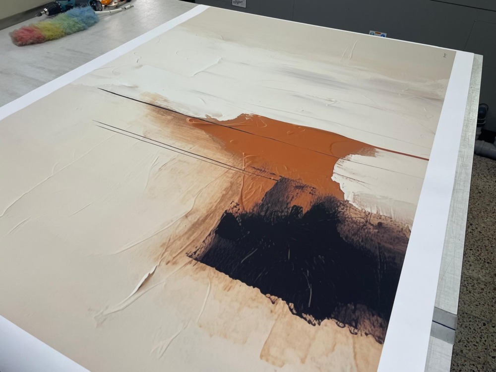 Abstract painting with terracotta orange and black brushstrokes on white canvas