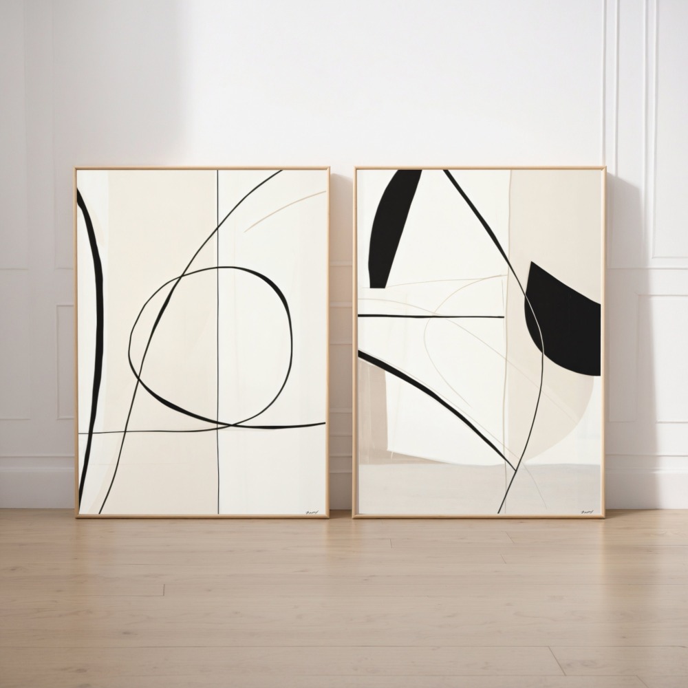 Elegant minimalist diptych with flowing black curves on cream canvas in natural frames