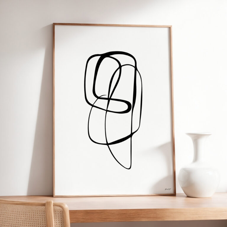 Abstract black line art in wooden frame with white ceramic vase