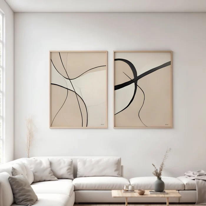 Minimalist abstract diptych with flowing black lines over cream in neutral living room