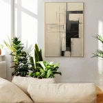 Minimalist living room featuring abstract wall art, potted plants, and natural light.