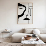Black and white abstract face line drawing in modern, minimalist living room.