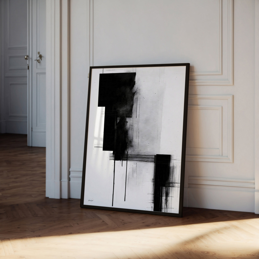 Abstract black and white brushstroke painting leaning against white wall in elegant room.