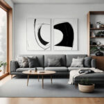 Elegant minimalist living room with striking black and white abstract art above gray sectional sofa.