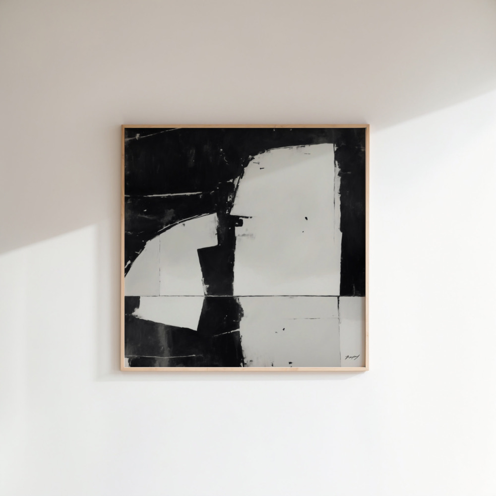 Abstract black and white geometric composition in wooden frame on white wall.