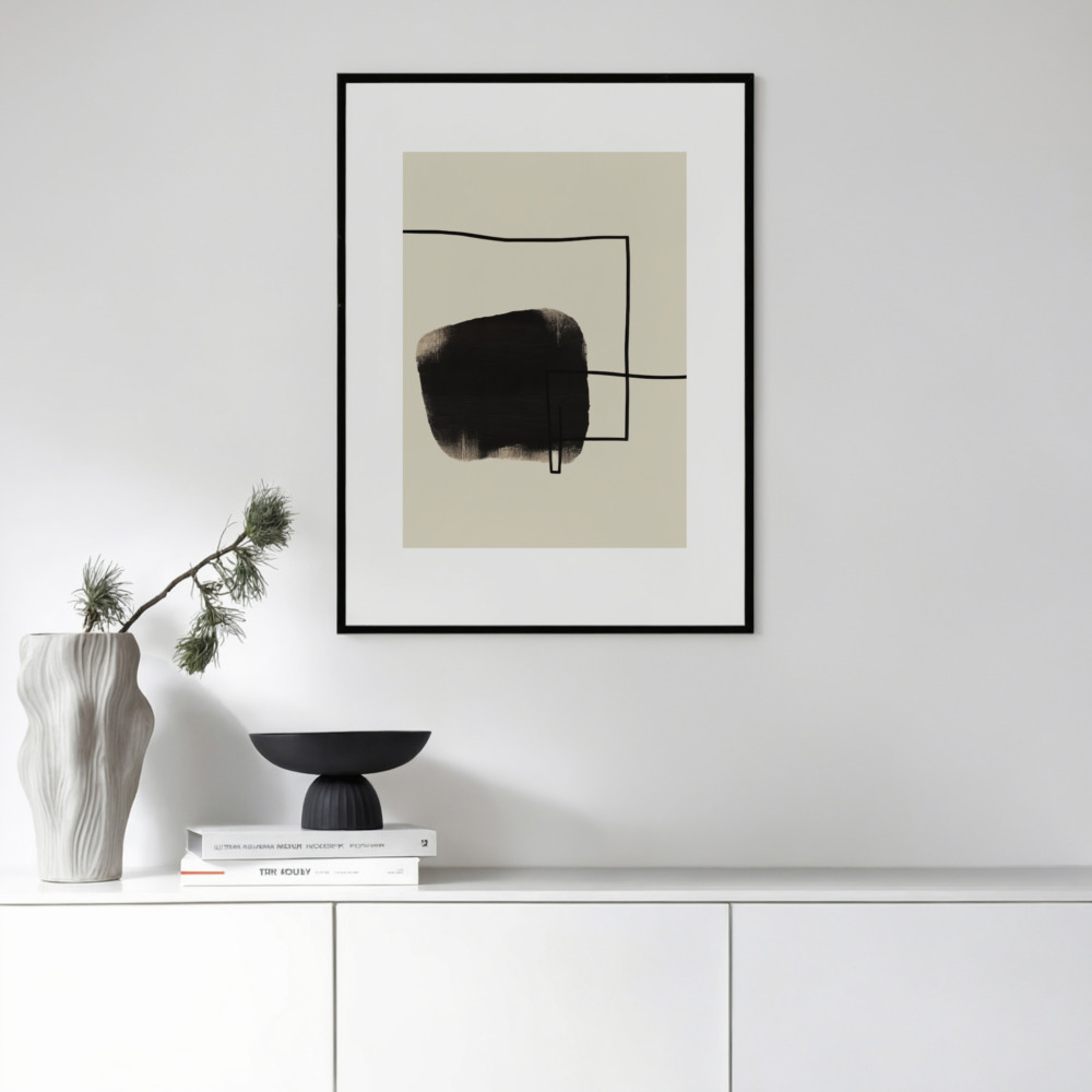 Minimalist abstract artwork above white console with stylish monochrome decor arrangement.
