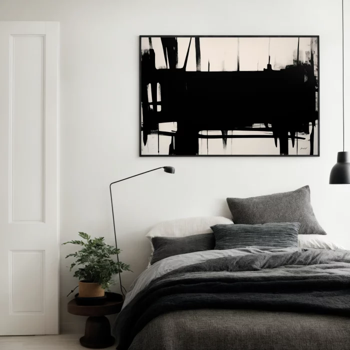 Minimalist bedroom with statement black and white abstract art above gray bedding