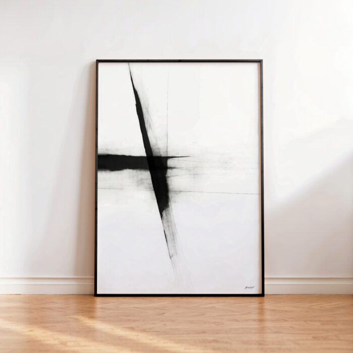 Bold black brushstroke abstract art in wooden frame against white wall