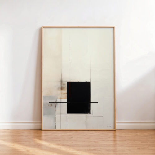 Minimalist black geometric artwork in wooden frame leaning against white wall on hardwood floor.