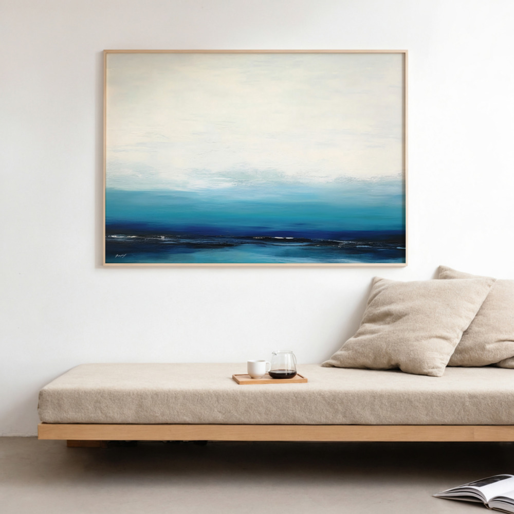 Abstract blue horizon artwork above minimalist wooden bench with beige cushion