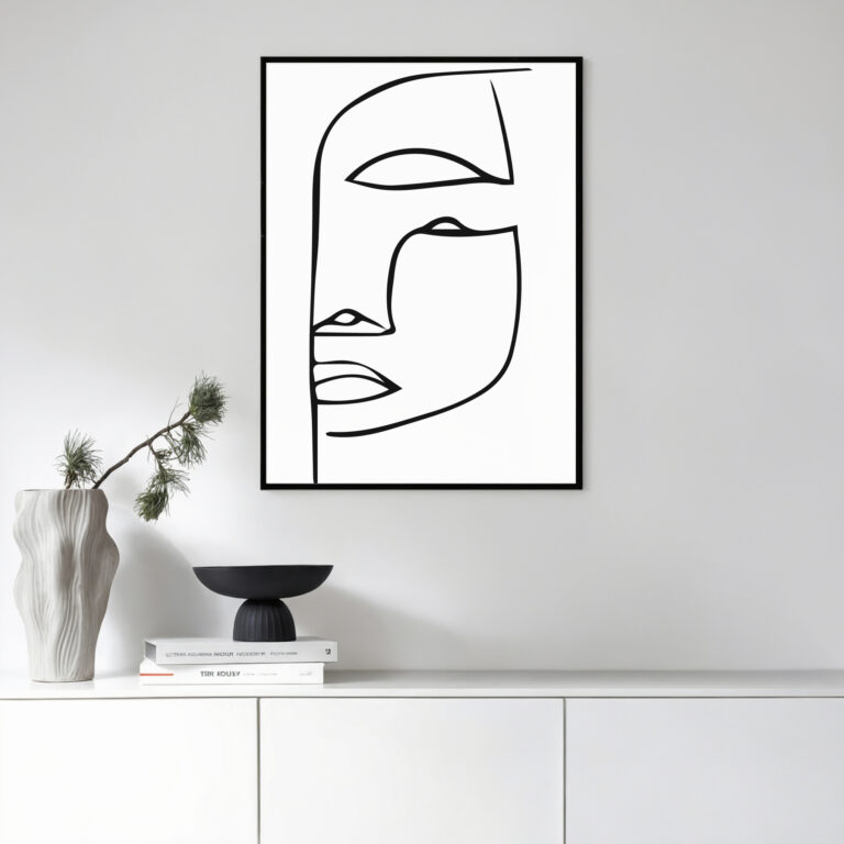 Minimalist line art face portrait with modern home decor on white console table