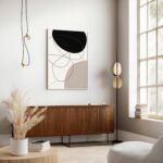 Modern abstract wall art with black and beige geometric shapes in minimalist neutral living room.