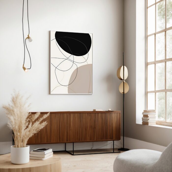 Modern abstract wall art with black and beige geometric shapes in minimalist neutral living room.