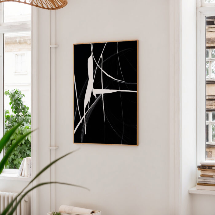 Black and white abstract art print in minimalist interior with natural elements