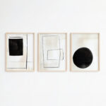 Minimalist black and white geometric triptych art in light wooden frames