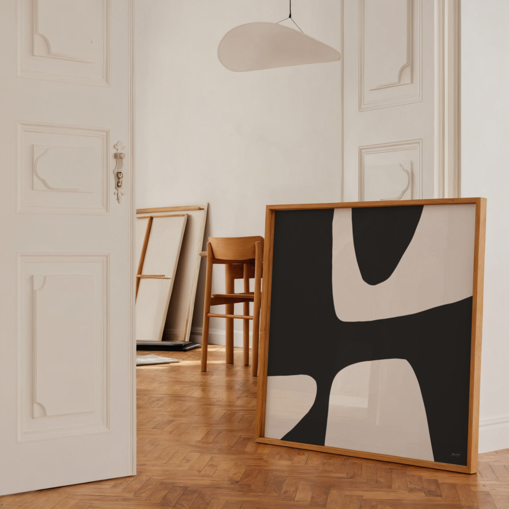 Black and white abstract art displayed in elegant interior with herringbone flooring