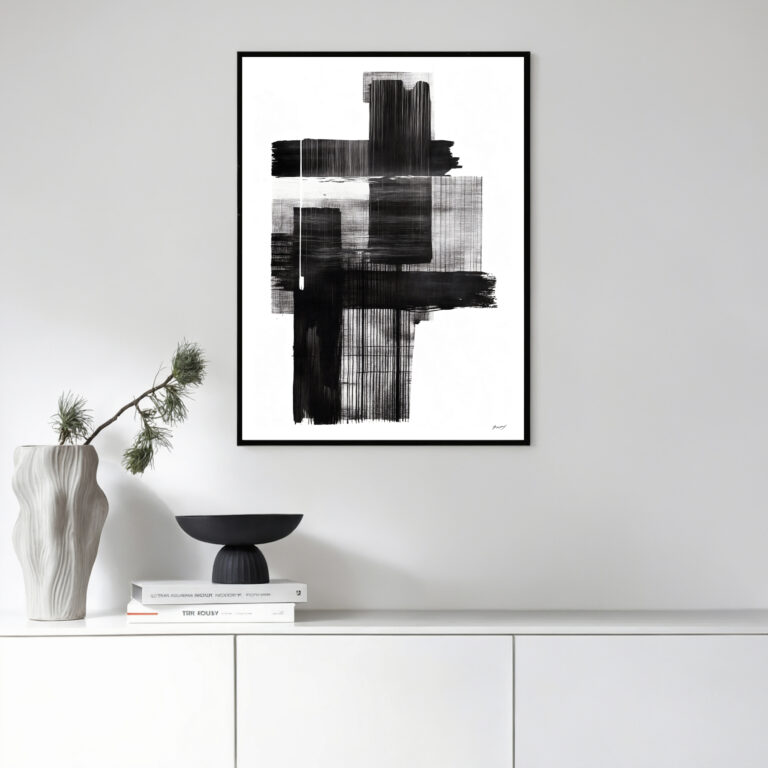 Bold black brushstroke art displayed in minimalist white interior with sleek decor.