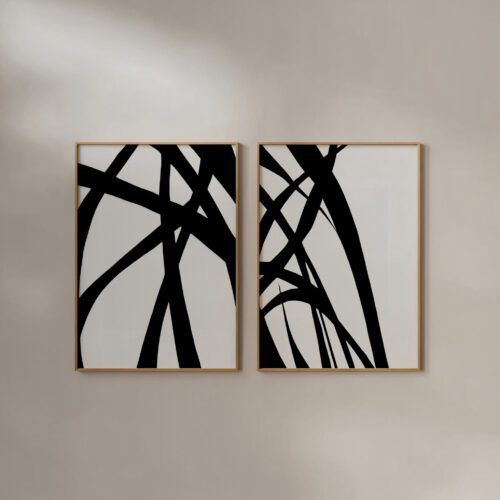 Minimalist black brushstroke diptych in wooden frames on white wall