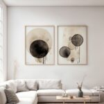 Abstract black and gray circular art adorning white living room with modern sectional sofa.