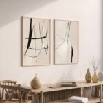 Abstract line art on cream wall above wooden console with neutral decor