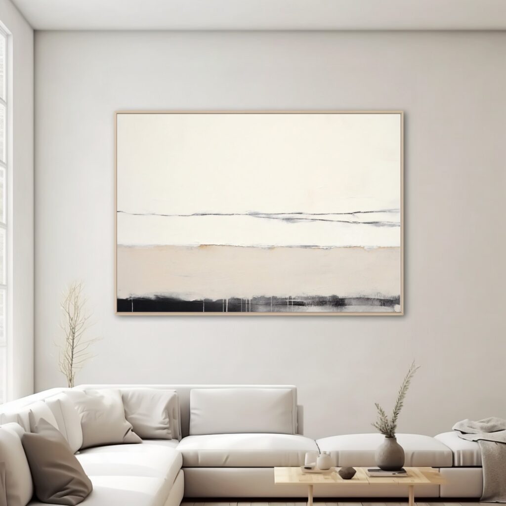Minimalist abstract canvas art in neutral tones anchoring modern living room setting.