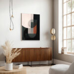 Minimalist living room with abstract geometric art above wooden credenza near sunny window.