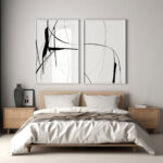 Abstract black line art prints above bed in minimalist modern bedroom.
