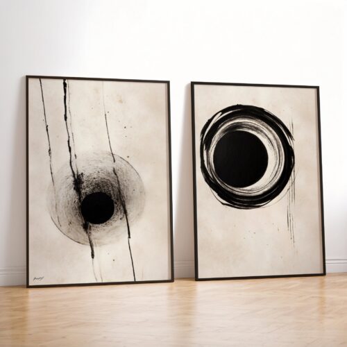 Two framed minimalist ink artworks - black circular patterns on cream background.