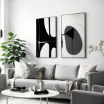 Modern living room with abstract black and white artwork and minimal furniture.