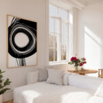 Modern minimalist living room with black spiral artwork and pink roses.