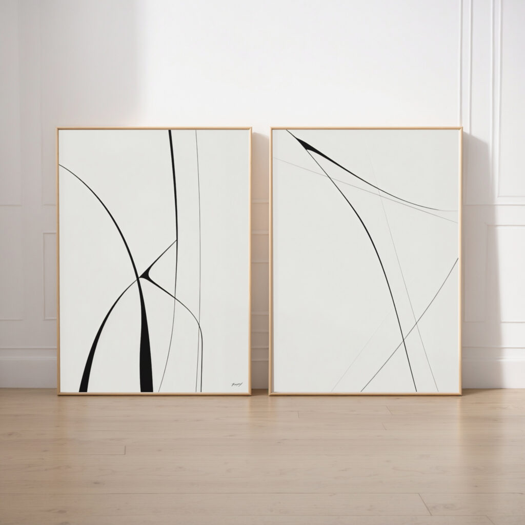 Modern abstract black line art diptych with elegant brushstrokes on light background.