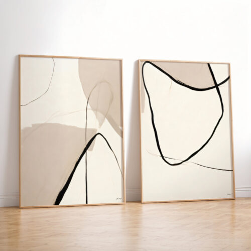 Abstract line art prints in black and beige with minimalist wooden frames.