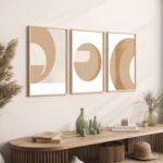 Minimalist circular triptych artwork above wooden console with decorative vases and dried botanicals