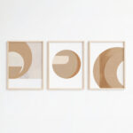 Minimalist geometric wall art triptych featuring circular shapes in warm beige and tan tones.