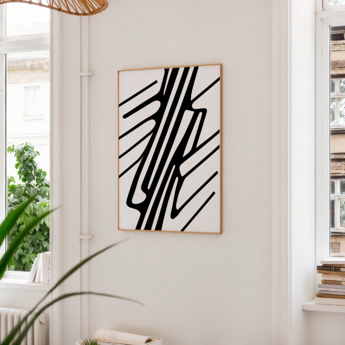 Minimalist black line geometric wall art in bright modern interior with plants.
