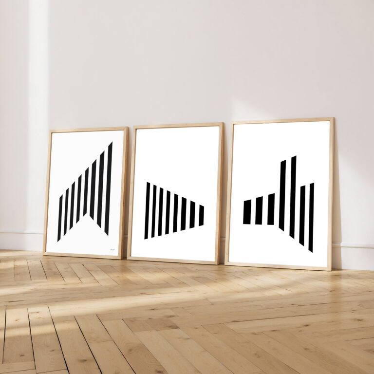 Three minimalist black line art prints in wooden frames on herringbone floor.