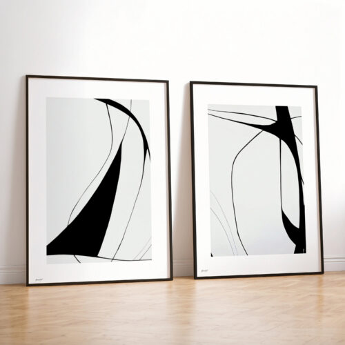 Two framed black and white minimalist art prints with flowing curved abstract lines.