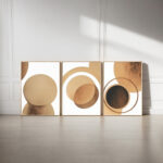 Abstract triptych wall art with minimalist brown circles on white background.
