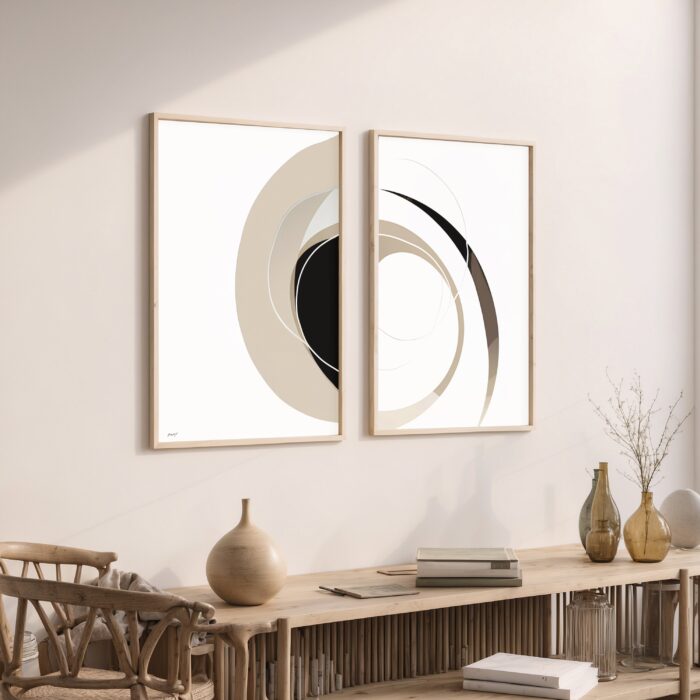 Minimalist black and white abstract wall art duo above stylish wooden console table.
