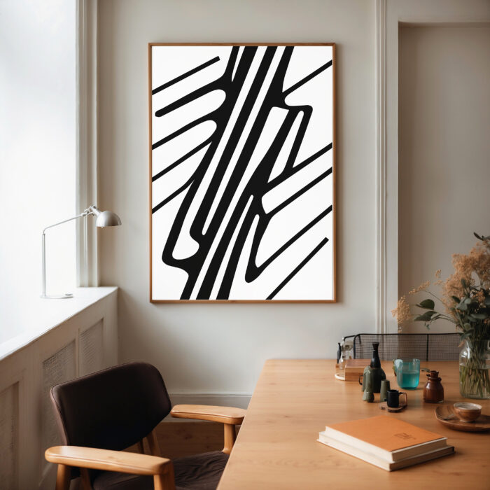 Abstract black brushstroke art displayed above wooden dining table in contemporary interior space.