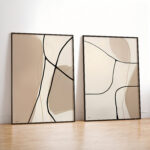 Minimalist abstract art prints with curved black lines on neutral beige backgrounds, framed in black.