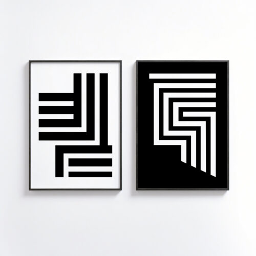Two minimalist black and white geometric art prints in slim frames on white wall.