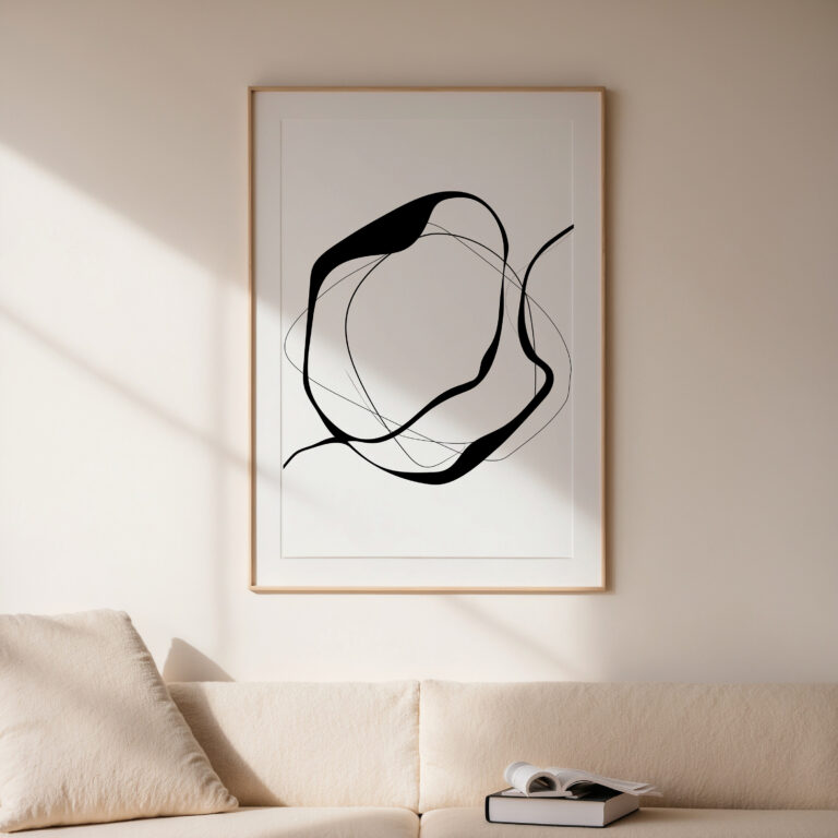 Minimalist black line abstract art in wooden frame above beige sofa in contemporary space.