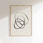 Minimalist black line art featuring flowing organic curves in light wooden frame.