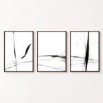 Three black brushstroke panels in thin frames creating minimalist abstract wall art triptych.