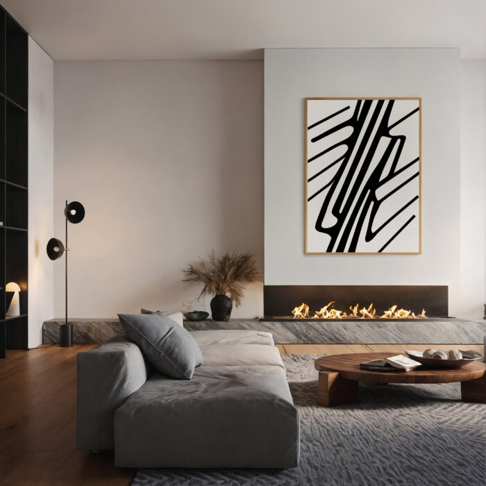 Black and white geometric art above modern fireplace in minimalist gray living room.