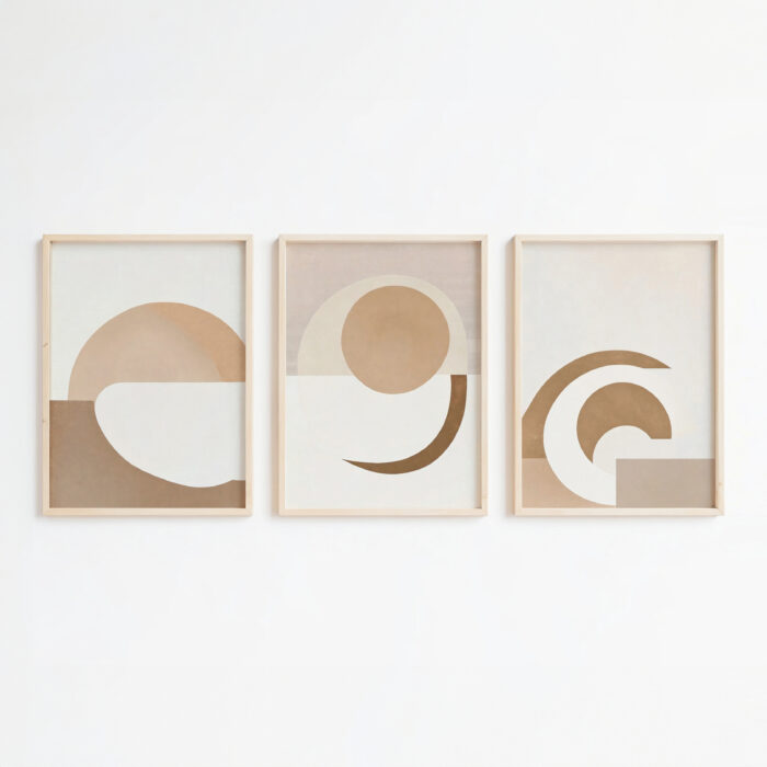 Minimalist earth tone geometric triptych wall art with curved shapes in wooden frames.