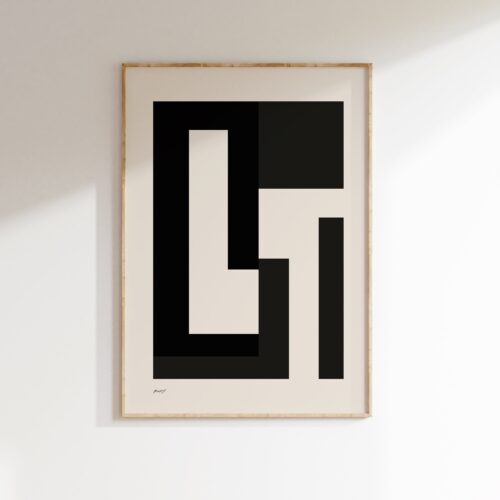Minimalist black and white geometric artwork in wooden frame on white wall.