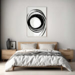 Bold black swirl abstract art above bed in minimalist Scandinavian-style bedroom.