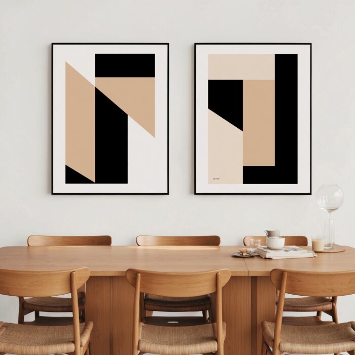 Minimalist black and beige geometric art pair above wooden dining table with six chairs.